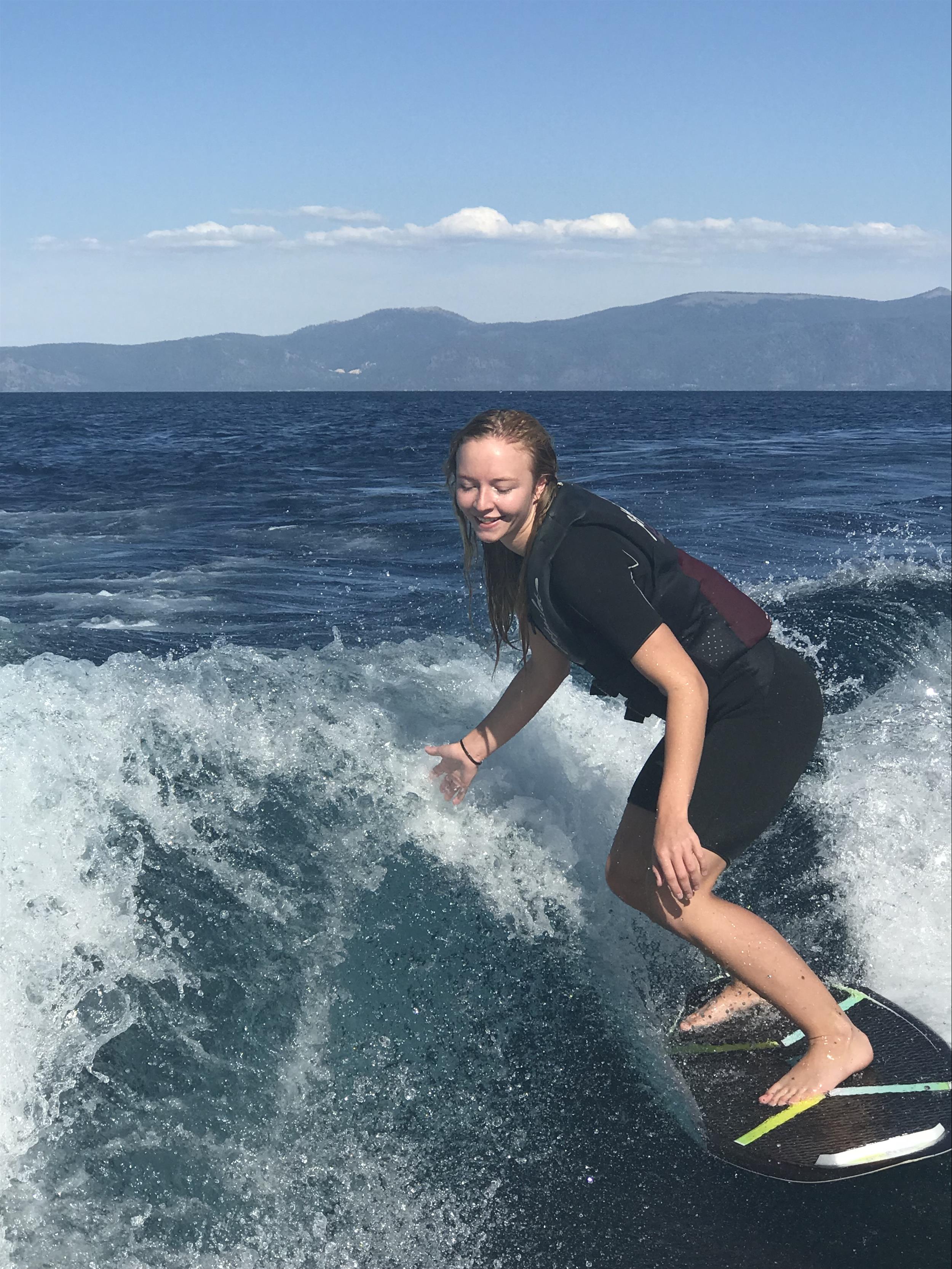 girl surfing in the water